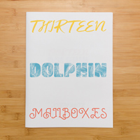 Thirteen Dolphin Mailboxes